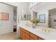 Elegant bathroom with double sinks and a large mirror at 11691 E Turquoise Ave, Scottsdale, AZ 85259