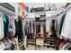 Large walk-in closet with ample hanging and shelving space at 11691 E Turquoise Ave, Scottsdale, AZ 85259