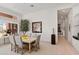 Bright dining room with large window and access to backyard at 11691 E Turquoise Ave, Scottsdale, AZ 85259