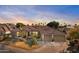 Beautiful desert home with tile roof, two-car garage, and mature landscaping at 11691 E Turquoise Ave, Scottsdale, AZ 85259