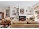 Relaxing living room with fireplace and comfortable seating at 11691 E Turquoise Ave, Scottsdale, AZ 85259