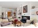 Comfortable living room with fireplace and built-in shelving at 11691 E Turquoise Ave, Scottsdale, AZ 85259