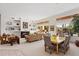 Spacious living room with fireplace and access to backyard patio at 11691 E Turquoise Ave, Scottsdale, AZ 85259