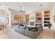 Living area with fireplace and built-in shelving at 11691 E Turquoise Ave, Scottsdale, AZ 85259
