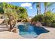 Refreshing pool with a waterfall feature at 11691 E Turquoise Ave, Scottsdale, AZ 85259