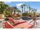 Relaxing pool area with lounge chairs and palm trees at 11691 E Turquoise Ave, Scottsdale, AZ 85259