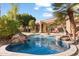 Stunning pool and spa with lush landscaping at 11691 E Turquoise Ave, Scottsdale, AZ 85259