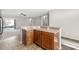 Kitchen island with wood cabinets and granite countertops at 11702 W Madison St, Avondale, AZ 85323