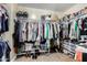 Large walk-in closet with ample hanging and shelving space at 12358 W Glenrosa Ave, Avondale, AZ 85392