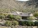 Single-story home with tile roof and desert landscaping, mountain views at 14065 N 111Th Pl, Scottsdale, AZ 85255