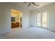 Bedroom with French doors opening to a patio and en-suite bathroom at 14065 N 111Th Pl, Scottsdale, AZ 85255