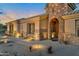 Elegant entryway with stonework and wrought iron gate at 14065 N 111Th Pl, Scottsdale, AZ 85255