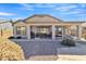 Covered patio with seating area, grill, and swing set, perfect for outdoor entertaining at 1456 E Leaf Rd, San Tan Valley, AZ 85140