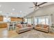 Spacious living room features a kitchen island and a comfortable sitting area at 1456 E Leaf Rd, San Tan Valley, AZ 85140