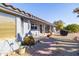 Landscaped backyard with a brick pathway and space for grilling at 14607 W Sky Hawk Dr, Sun City West, AZ 85375