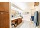 Bathroom with a bathtub, double sink, and wooden cabinets at 14607 W Sky Hawk Dr, Sun City West, AZ 85375