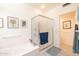 Clean bathroom with tub, shower, and updated flooring at 14607 W Sky Hawk Dr, Sun City West, AZ 85375