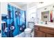 Clean bathroom with shower, toilet and wooden vanity at 14607 W Sky Hawk Dr, Sun City West, AZ 85375