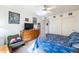 Bright bedroom with a double bed, dresser, and ceiling fan at 14607 W Sky Hawk Dr, Sun City West, AZ 85375