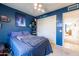 Spacious bedroom with a full-size bed and closet at 14607 W Sky Hawk Dr, Sun City West, AZ 85375