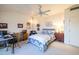 Bedroom with a queen bed and wood dresser at 14607 W Sky Hawk Dr, Sun City West, AZ 85375