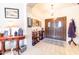 Bright entryway with wood floors and double doors at 14607 W Sky Hawk Dr, Sun City West, AZ 85375