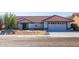 Single-story home with tile roof and desert landscaping at 14607 W Sky Hawk Dr, Sun City West, AZ 85375