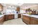 Spacious kitchen featuring wood cabinets and ample counter space at 14607 W Sky Hawk Dr, Sun City West, AZ 85375