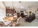 Comfortable living area with leather sofa and wood accents at 14607 W Sky Hawk Dr, Sun City West, AZ 85375