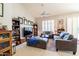 Comfortable living room with sectional sofa and built-in shelving at 14607 W Sky Hawk Dr, Sun City West, AZ 85375