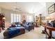 Spacious living room with comfortable seating and dining area at 14607 W Sky Hawk Dr, Sun City West, AZ 85375