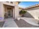 Front entry with security door, small table, and desert plants at 15511 W Agua Linda Ln, Surprise, AZ 85374