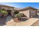 Front view of single-story home with tile roof and security door at 15511 W Agua Linda Ln, Surprise, AZ 85374