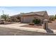 Single-story home with tile roof and a two-car garage at 15511 W Agua Linda Ln, Surprise, AZ 85374