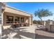 Spacious patio with seating area and view of landscaped backyard at 15511 W Agua Linda Ln, Surprise, AZ 85374