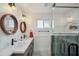 Modern bathroom featuring double sinks, granite countertops, and a luxurious walk-in shower at 1632 E Maryland Ave, Phoenix, AZ 85016