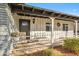 Inviting front porch featuring a seating area and decorative wreath on the door at 1632 E Maryland Ave, Phoenix, AZ 85016