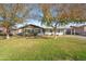 Charming single-story home featuring a well-maintained front yard and mature trees at 1632 E Maryland Ave, Phoenix, AZ 85016