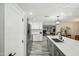 Modern kitchen with stainless steel appliances and granite countertops, seamlessly connecting living spaces at 1632 E Maryland Ave, Phoenix, AZ 85016