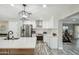 Well-lit kitchen featuring stainless steel appliances, granite countertops, and white cabinets at 1632 E Maryland Ave, Phoenix, AZ 85016