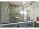 This modern bathroom features an enclosed shower with eye catching tile, and sleek fixtures at 1632 E Maryland Ave, Phoenix, AZ 85016