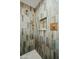 This modern bathroom features an enclosed shower with eye catching tile, bronze fixtures, and shower niche at 1632 E Maryland Ave, Phoenix, AZ 85016