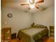 Cozy bedroom with a double bed, ceiling fan and wood flooring at 17241 N 16Th Dr # 10, Phoenix, AZ 85023