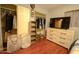Spacious bedroom with large closet, dresser and shelving unit at 17241 N 16Th Dr # 10, Phoenix, AZ 85023
