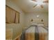 Bright bedroom with striped bedding, ceiling fan, and window coverings at 17241 N 16Th Dr # 10, Phoenix, AZ 85023