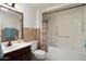 Clean bathroom with shower/tub combo and updated vanity at 17607 N Foothills Dr, Sun City, AZ 85373