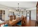 Bright dining area with hardwood floors and view to the kitchen at 17607 N Foothills Dr, Sun City, AZ 85373