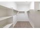 Spacious walk-in closet with shelving and hanging rods at 17768 W Onyx Ave, Waddell, AZ 85355