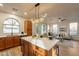 Open concept kitchen with island and breakfast bar, overlooking the living room at 1842 E Ellis St, Phoenix, AZ 85042