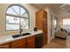 Kitchen with modern sink and appliances, and wood cabinets at 1842 E Ellis St, Phoenix, AZ 85042